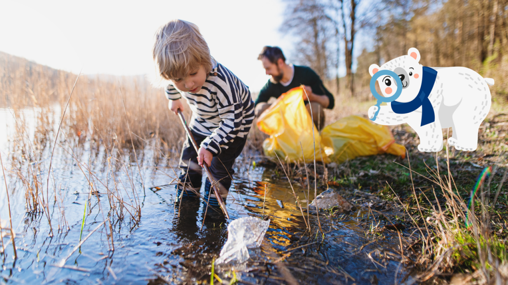 Mały chłopiec z tatą zbierają śmieci z jeziora – wspólne dbanie o środowisko - Miś Velvetuś zaprasza dzieci na wakacyjną przygodę… z higieną!